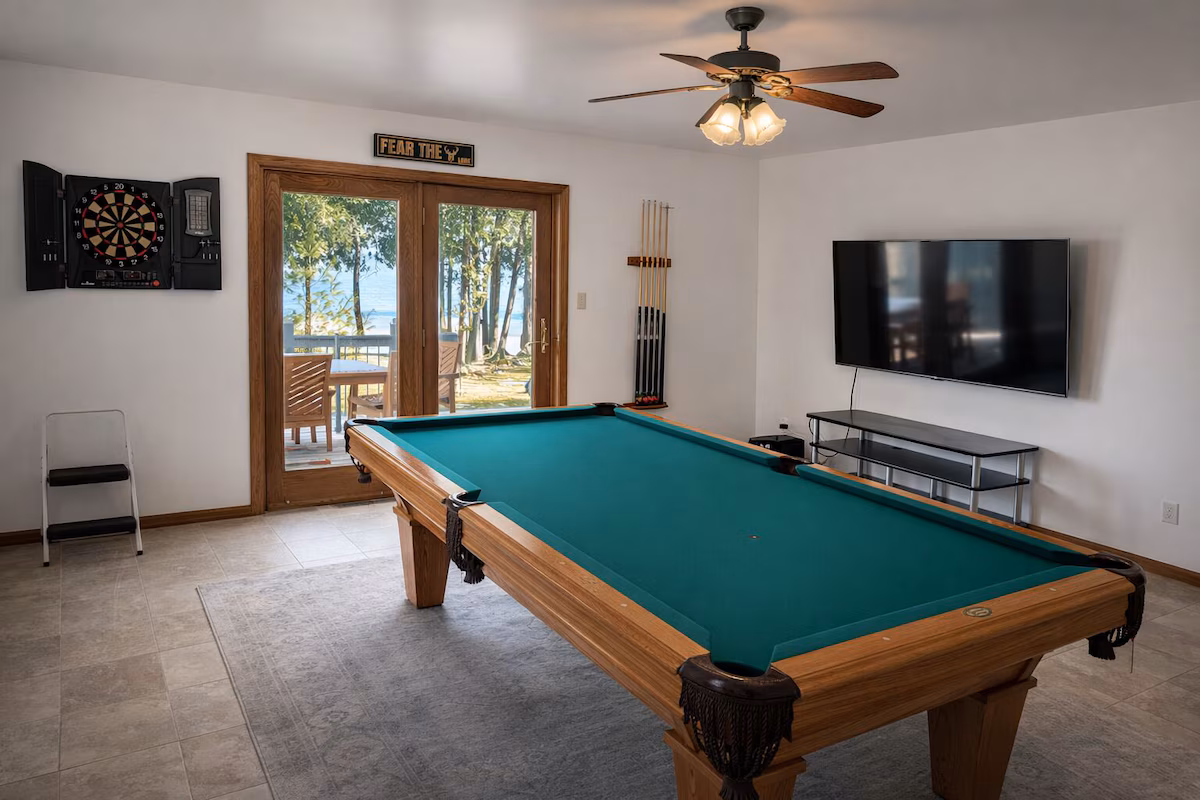 Game room with pool table for family entertainment