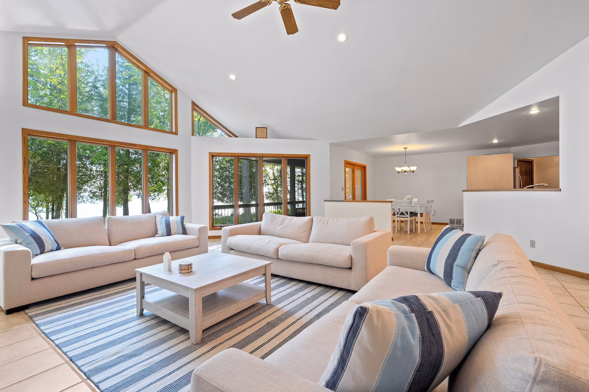 Open-concept living area with comfortable seating and lake views